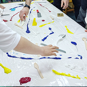 Students drawing in gallery